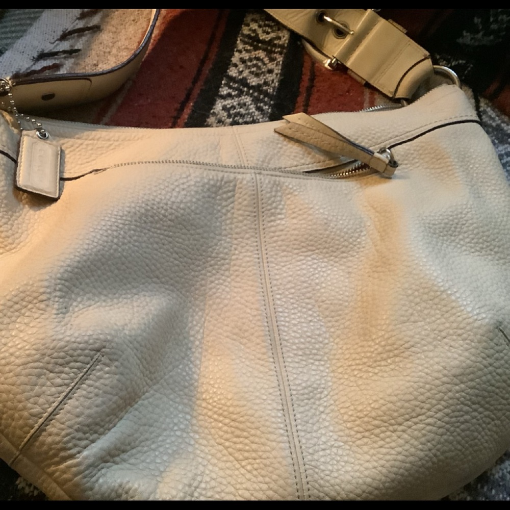 Used purse but in great shape. Coach cream